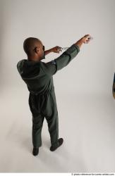 ERIC STANDING POSE WITH GUNS